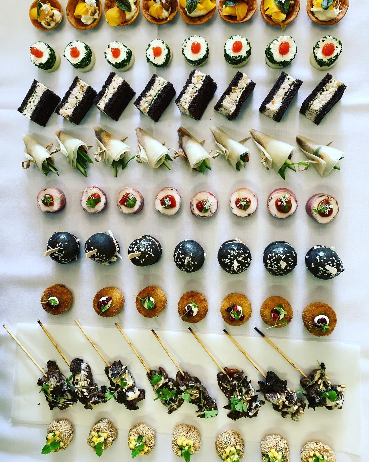 Rows of elegant assorted canapés