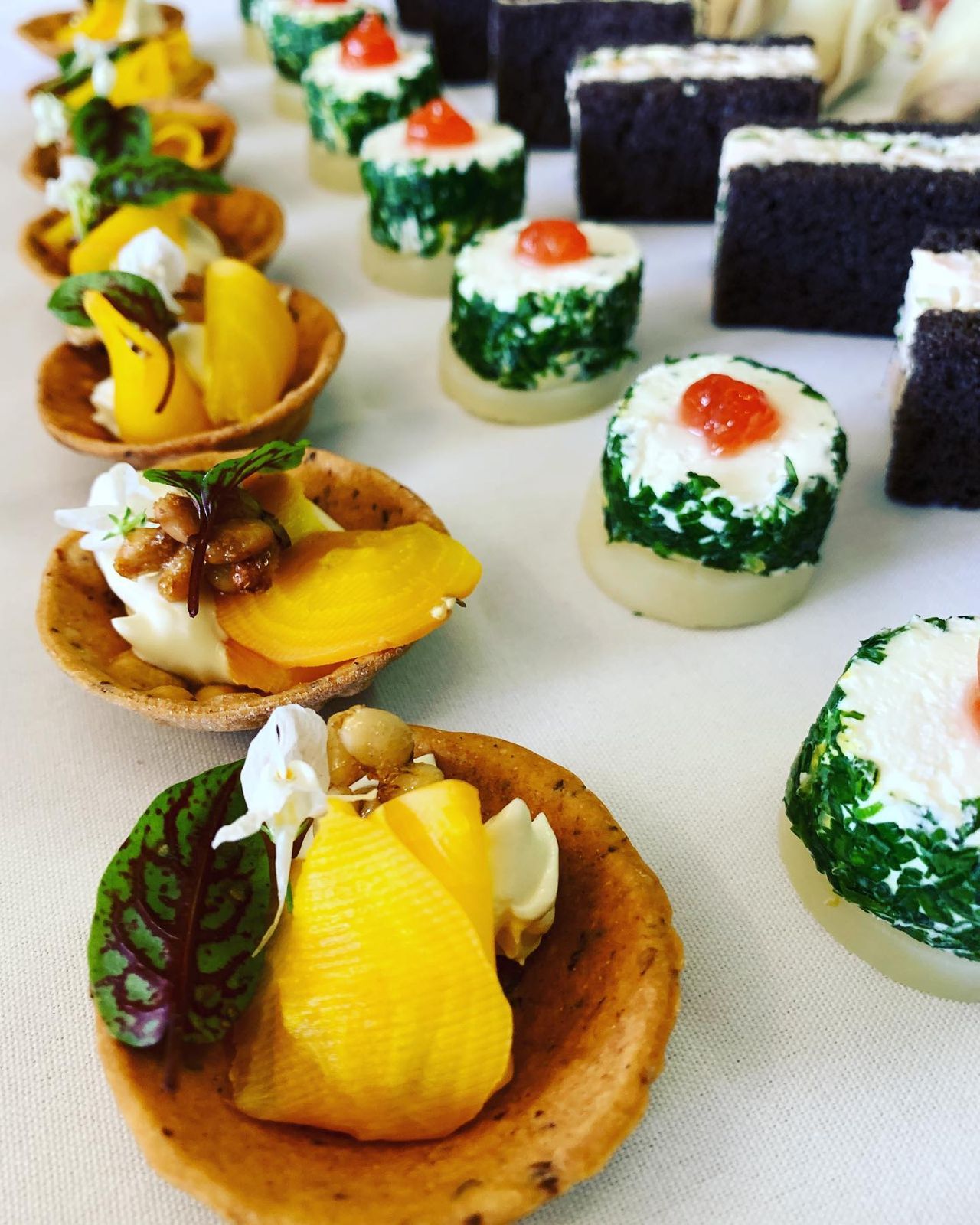 Bite-sized canapés with citrus and fresh herbs for an office cocktail party