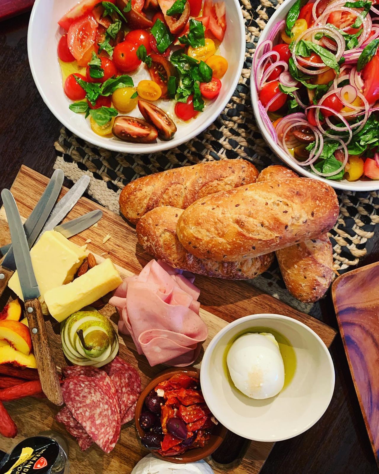 Lunch platter of cured meats, salads and fresh bread